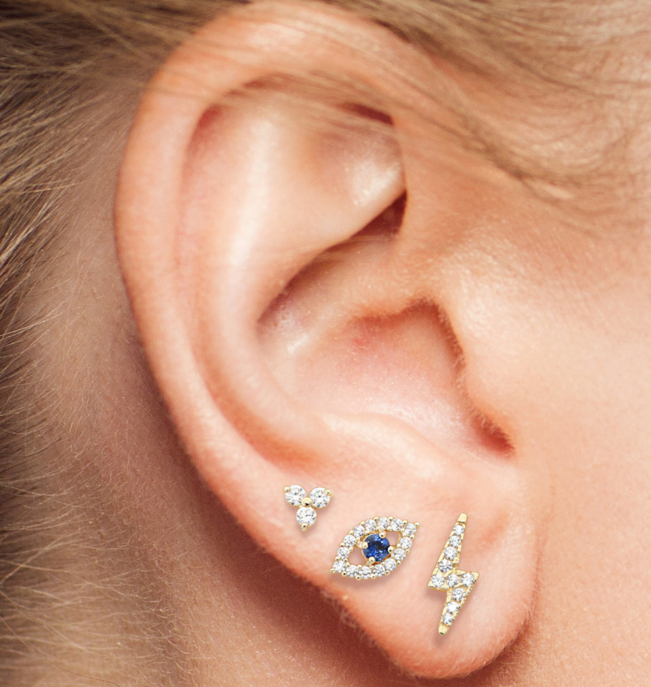 Casting a Spell: A Captivating Stack of Lotus, Evil Eye, and Lightning Earrings