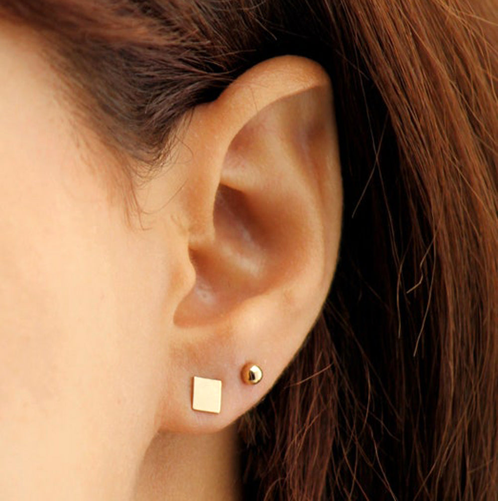 Geometry in Glamour: Elevate Your Style with a Square and Ball Earring Stack